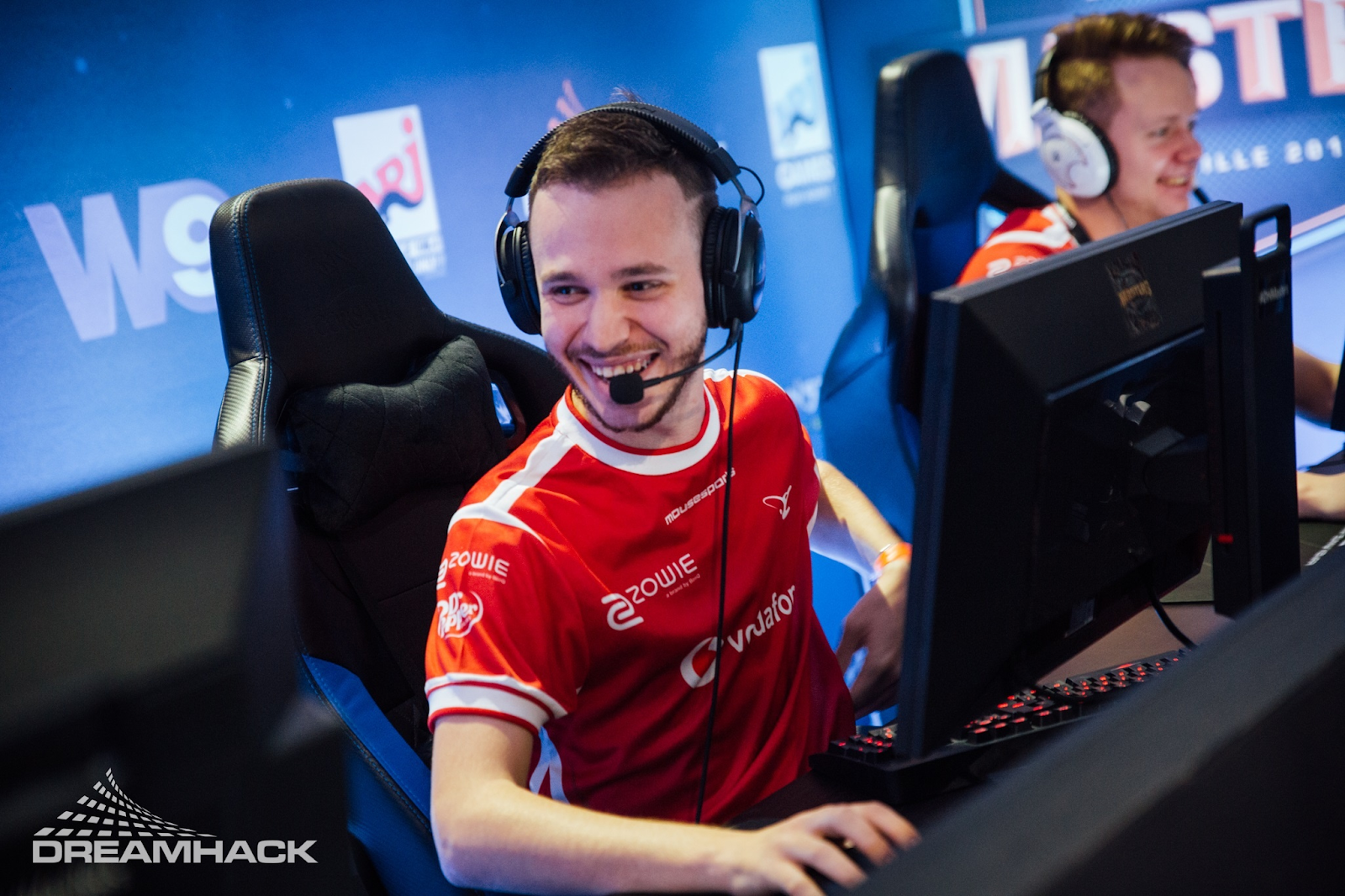 Martin 'STYKO' Styk jokes with a team mate between games at DreamHack