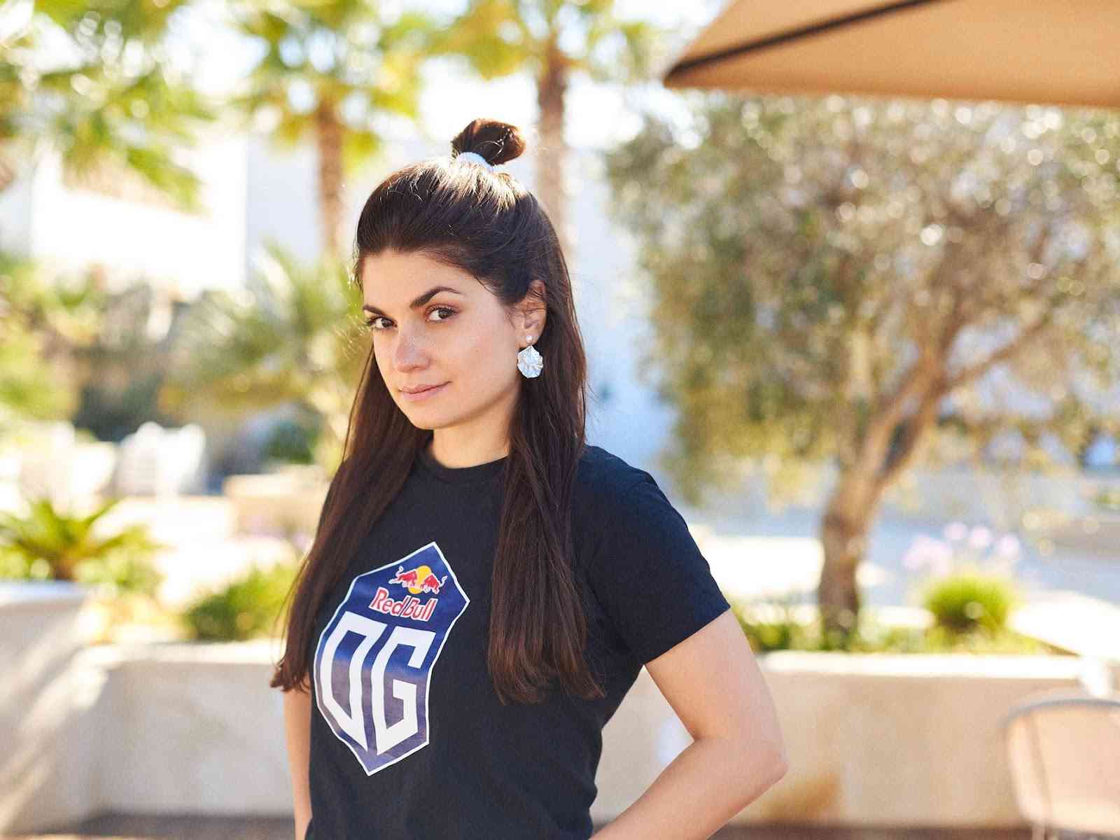 Vladyslava Zakhliebina poses outside wearing her OG jersey