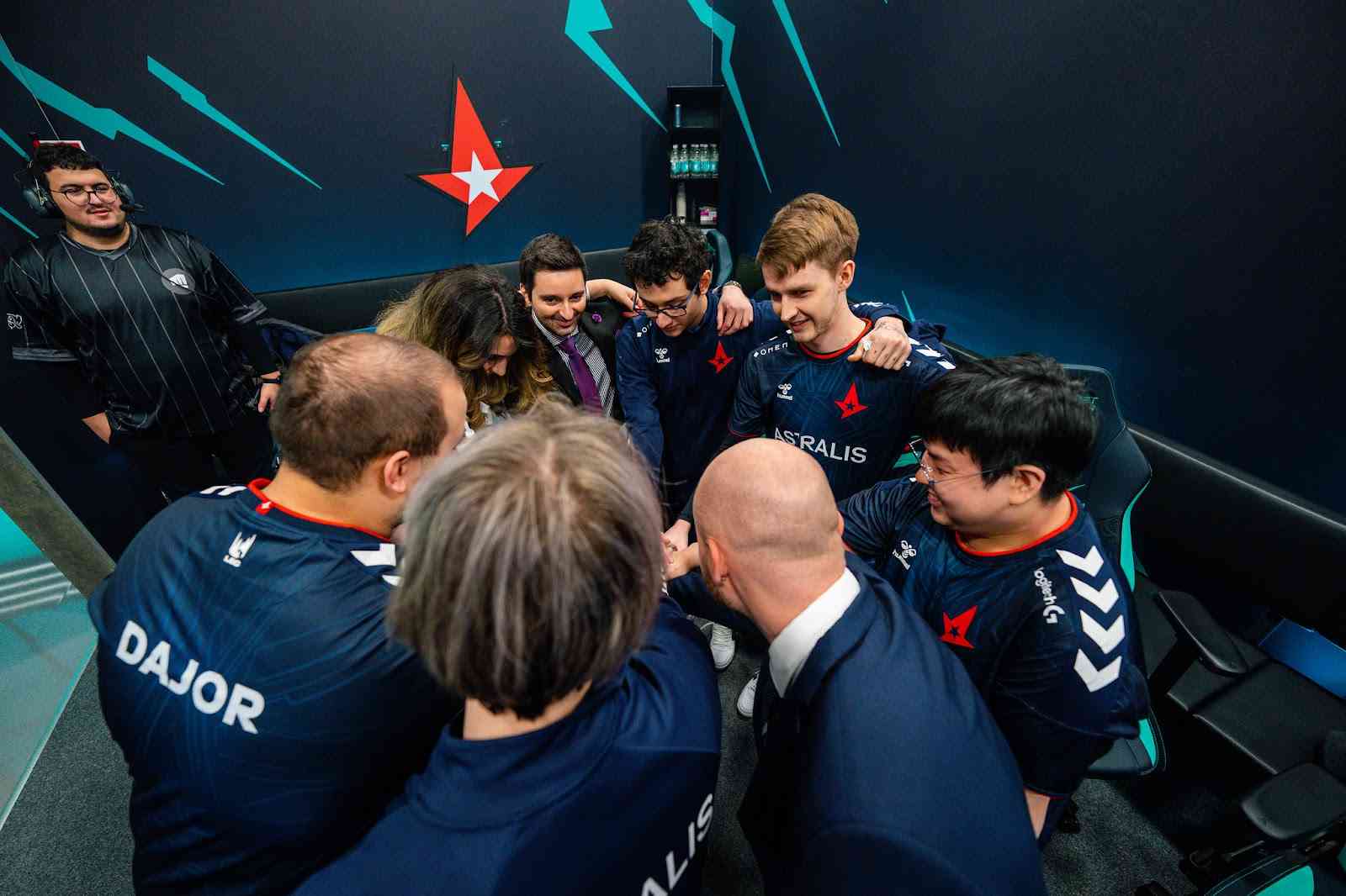 The roster for Astralis in a huddle backstage ahead of a game in the LEC.