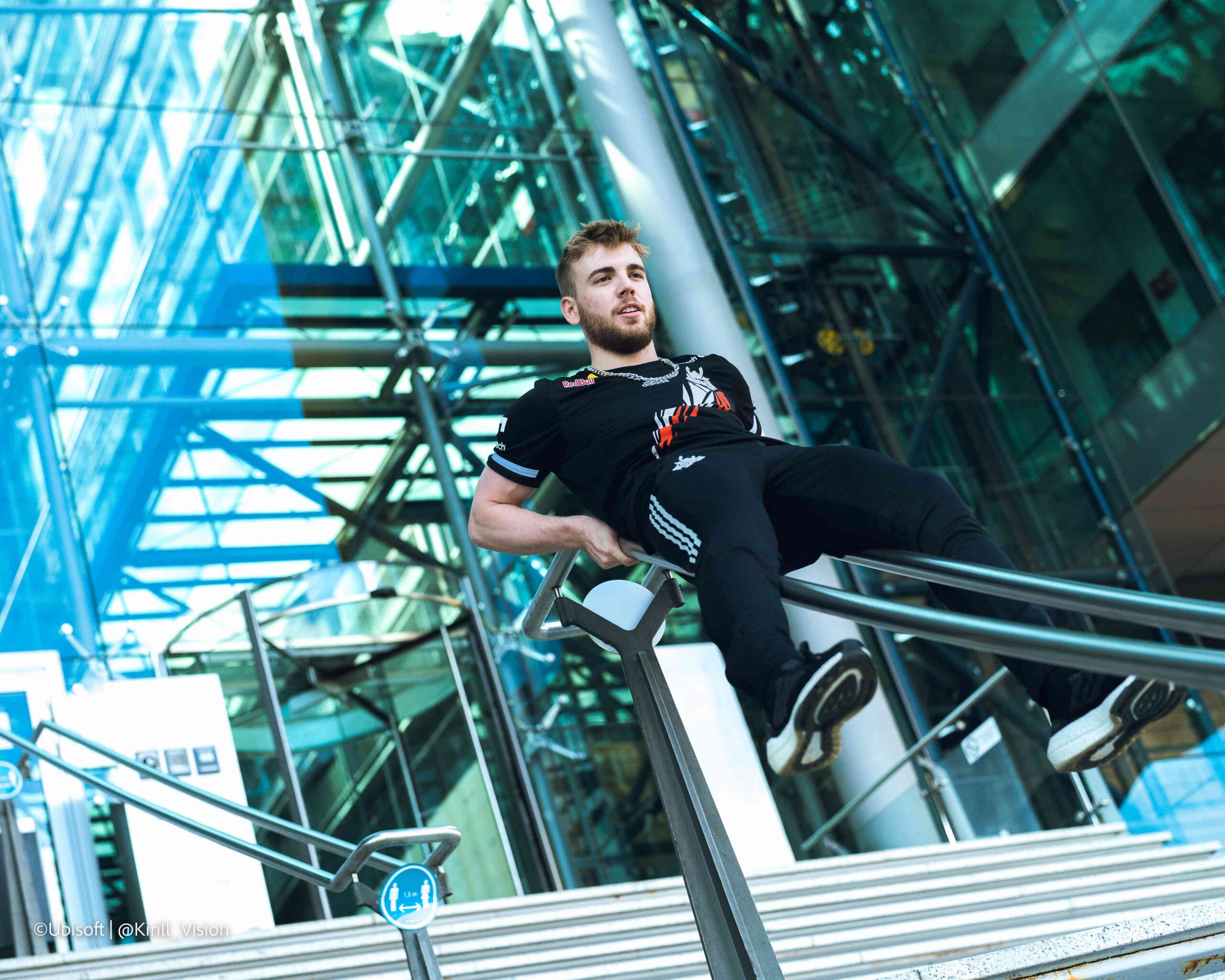 Alem4o slides down the banister of the stairs at the Six Major Berlin