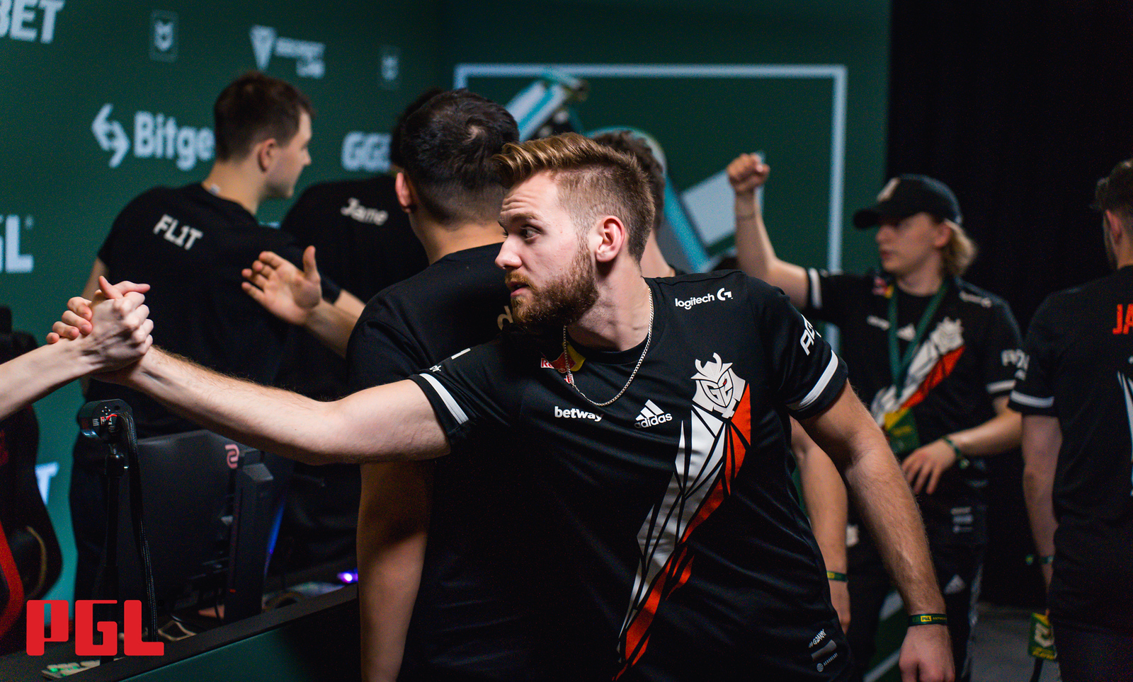 G2 players shake hands with their opponents at the end of a game of CS:GO at the Antwerp Major