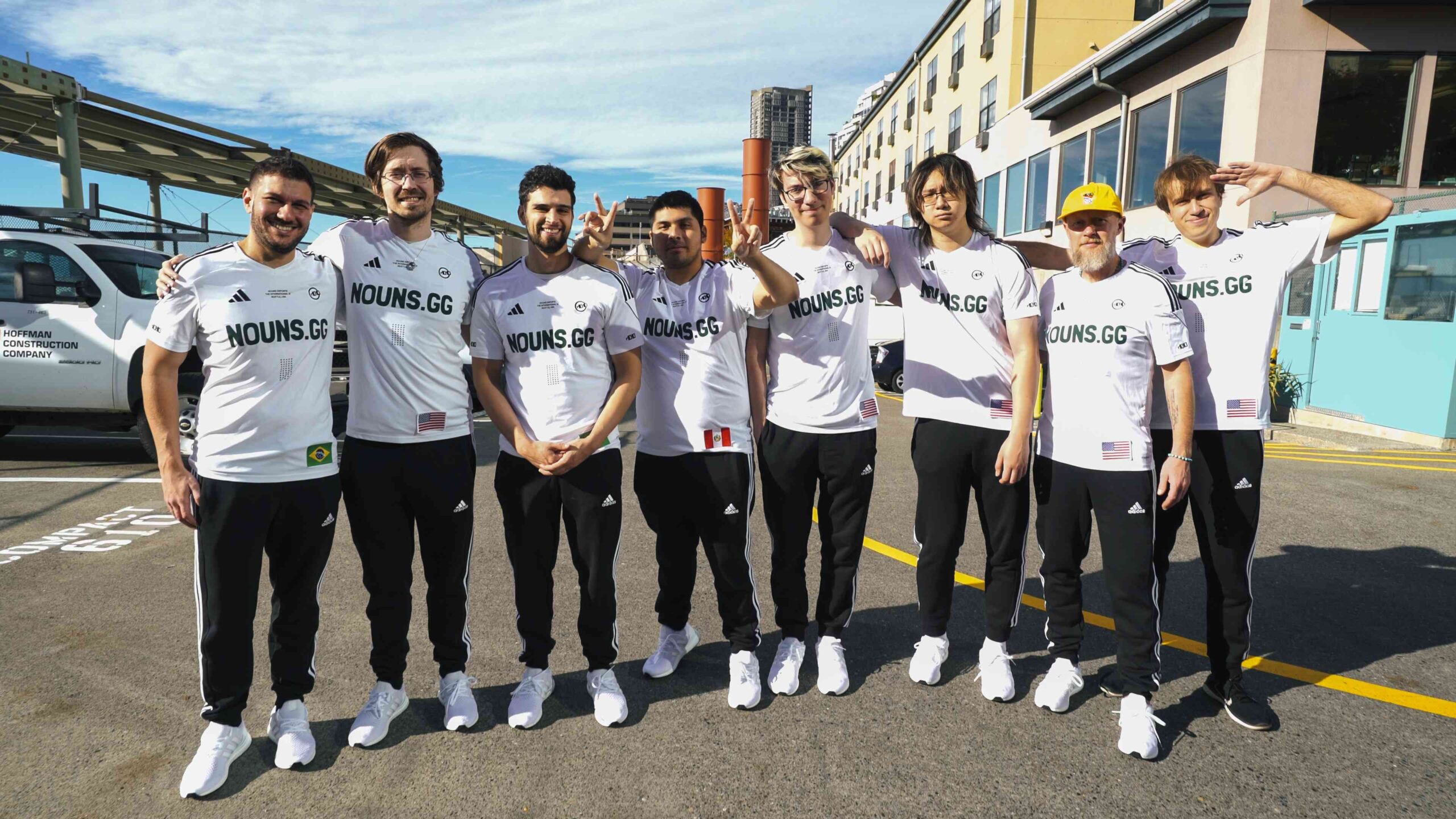 The roster for nouns stands, together with Edward Cleland, and pose for a photo ahead of The International 12 in Seattle