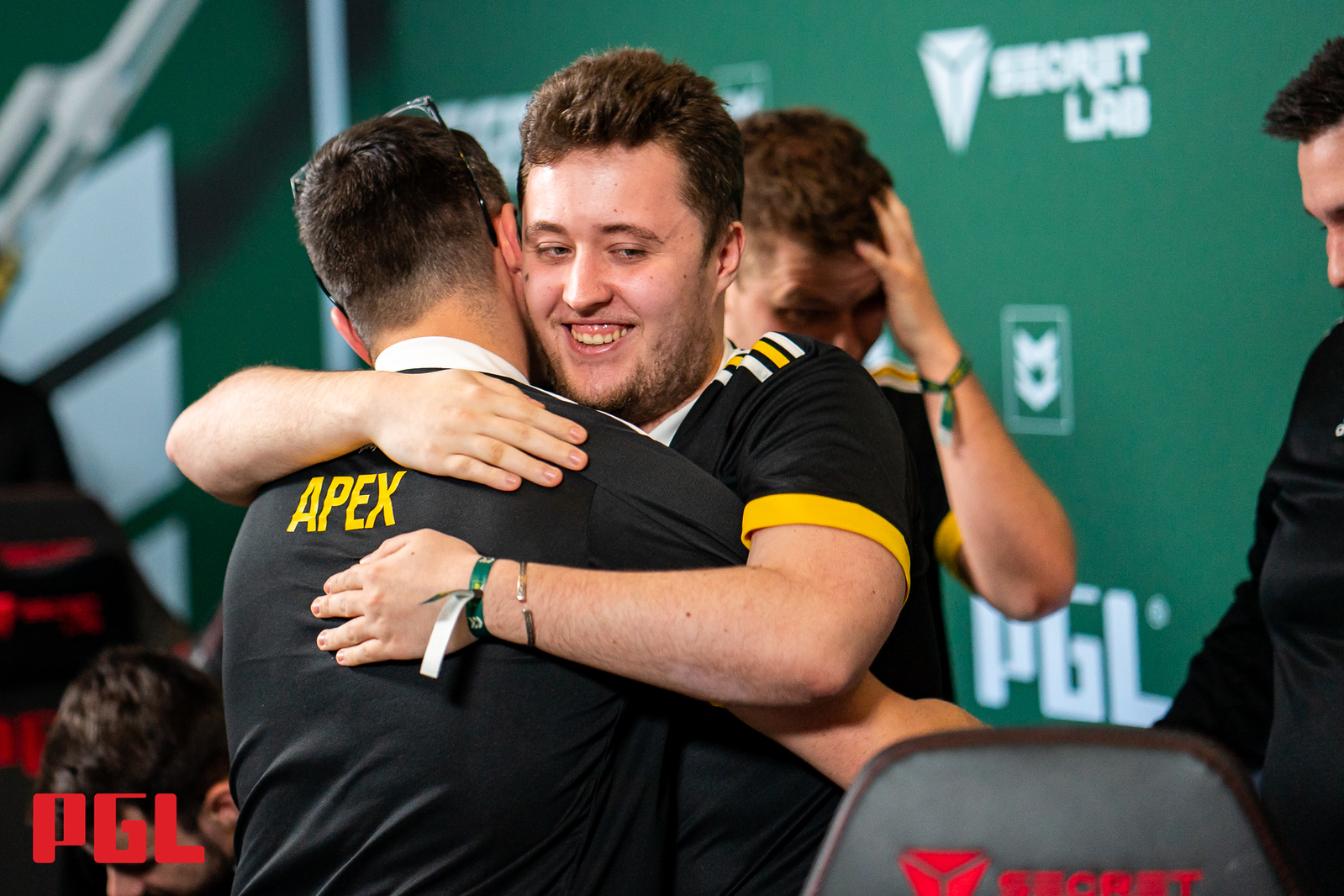 Team members from Vitality embrace after a win at the PGL Antwerp Major